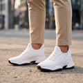 Man wearing STATURE Altitude white height increasing sneakers