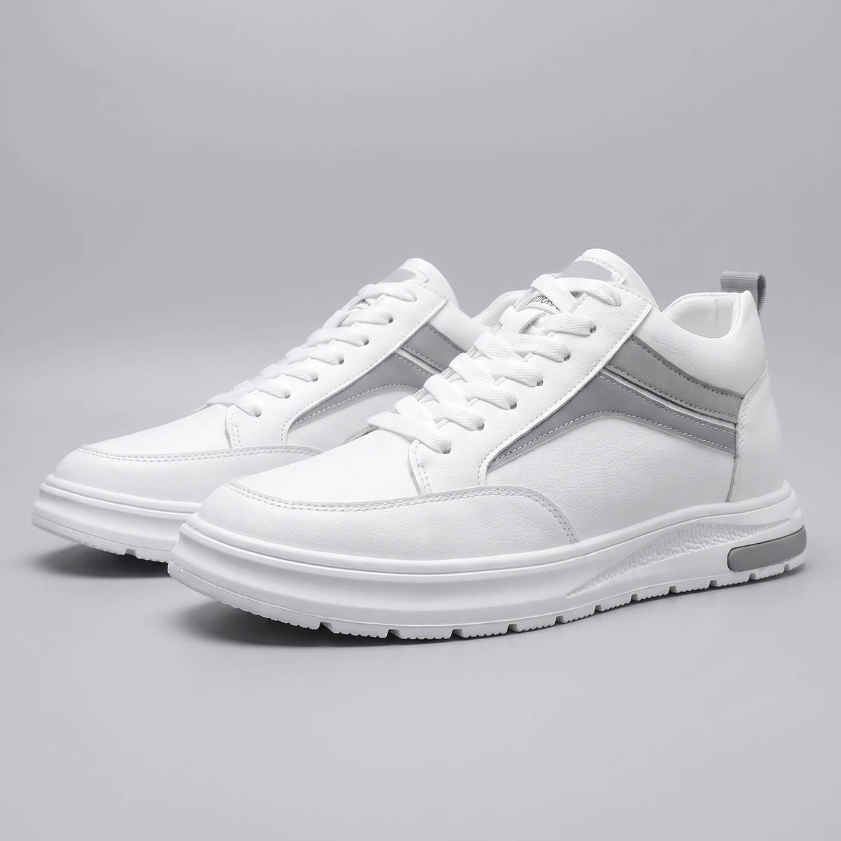 STATURE Prime white sneakers front three-quarter view